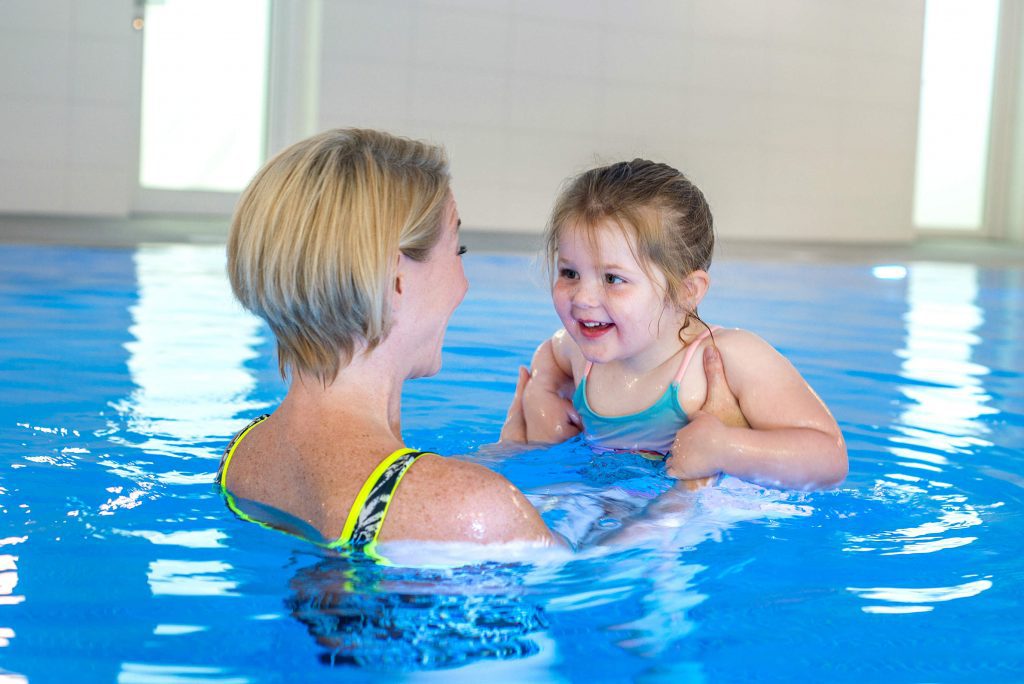 Mother and daughter in a swimming pool