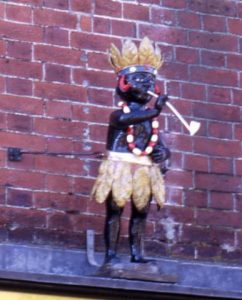 A statue in traditional dress outside the Merchant House