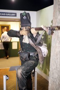 A Statue of Riffleman Harris holding his riffle inside the Royal Green Jackets (Rifles) Museum
