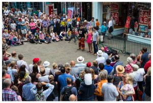 Hat Fair 2017 crowds gathered around a performance on the high street