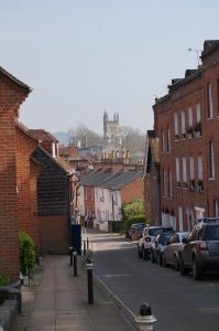 A street in Winchester with the Cathedral at the end