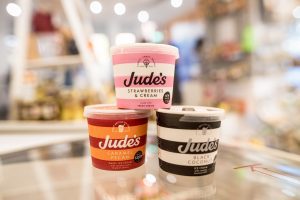 Three tubs of Judes Ice Cream stacked in the VIC