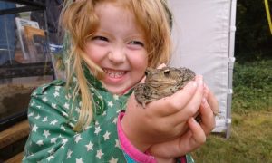 Girl with a frog